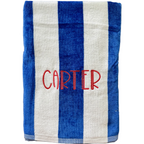 Blue and white personalized cabana stripe beach towel with name Carter embroidered in red